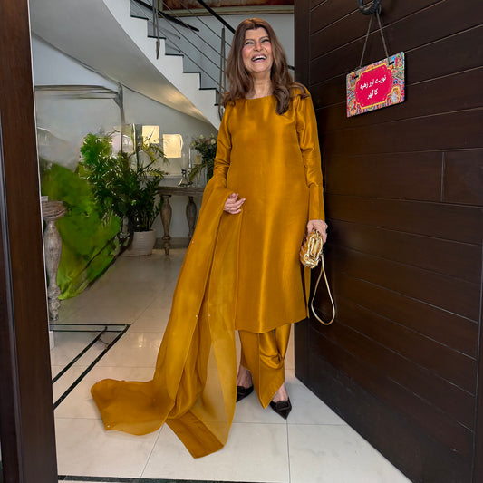 Rubina Ashraf In Mustard-Sharp Cut, Classic Roots